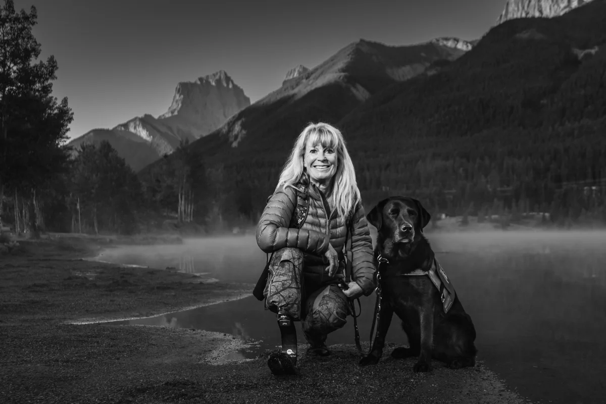 Chris Mullin Photography - Portraits - B&W female with service dog - Rockies